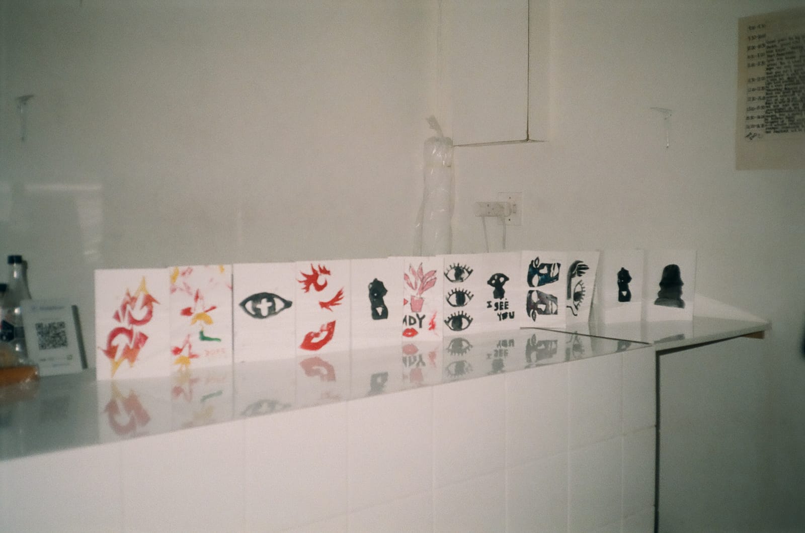 Summer Camp, 2015 — finished foam-stamp prints lined up along a tiled counter